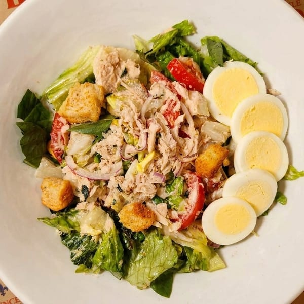 Fresh tuna salad with lettuce, tomatoes, and hard-boiled eggs at Little Provence Cafe