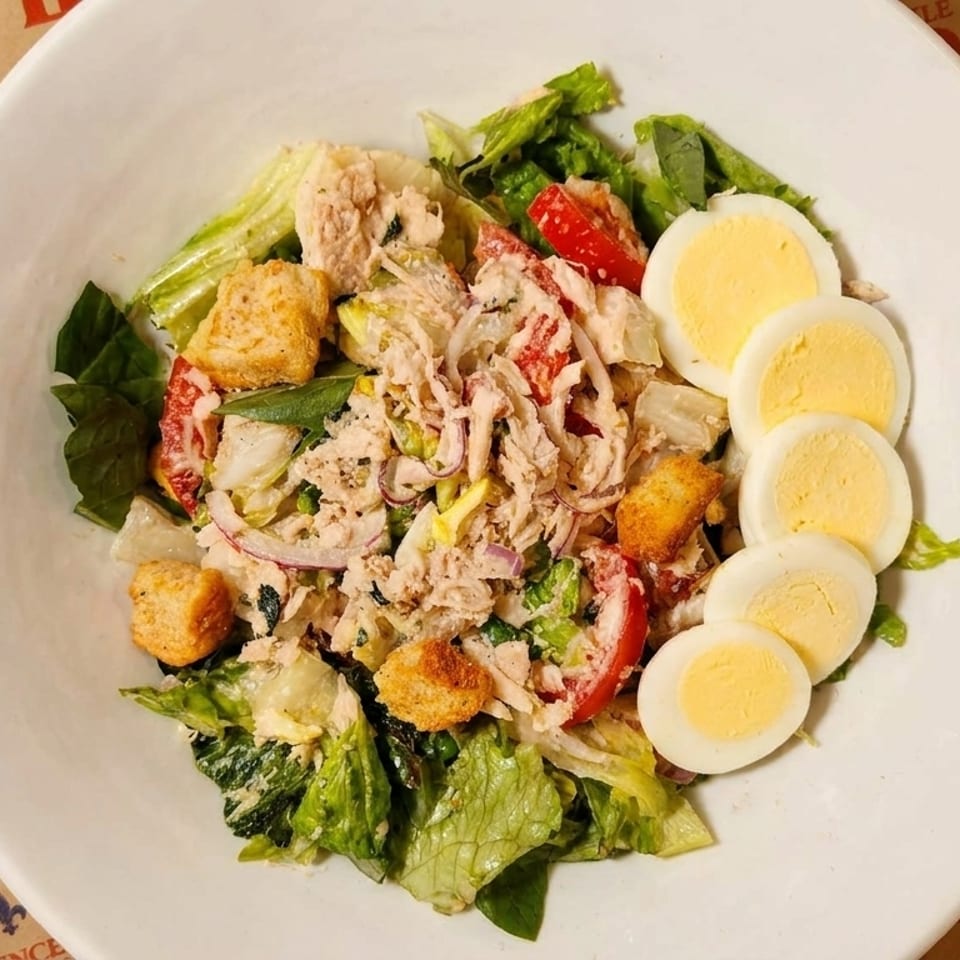 Fresh tuna salad with lettuce, tomatoes, and hard-boiled eggs at Little Provence Cafe