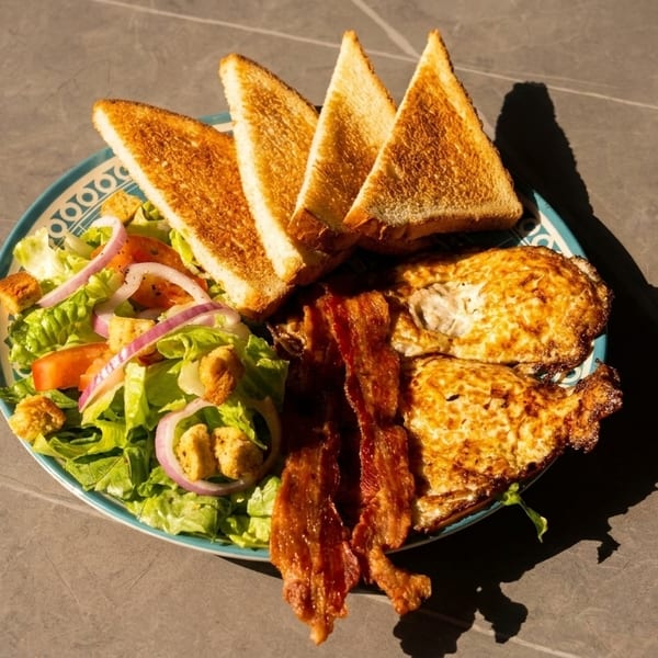 French breakfast plate with eggs, bacon, and toast at Little Provence Cafe Arcadia